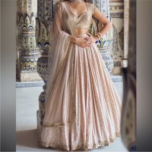 Cream/nude lehenga with Gold accent
